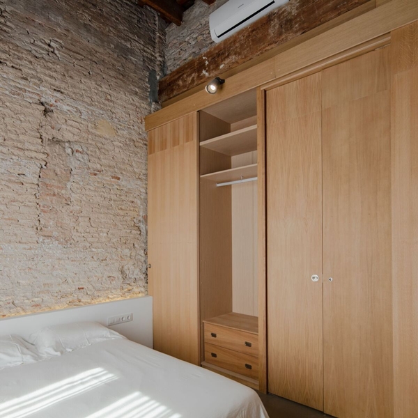 Musico-apartment-has-a-divider-which-doubles-as-a-wardrobe.jpg
