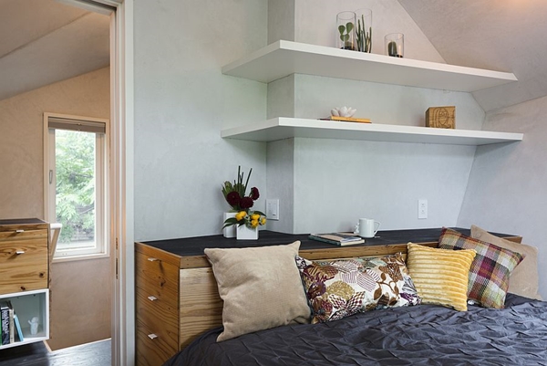 Bedroom-with-slim-shelving-and-angled-walls.jpg